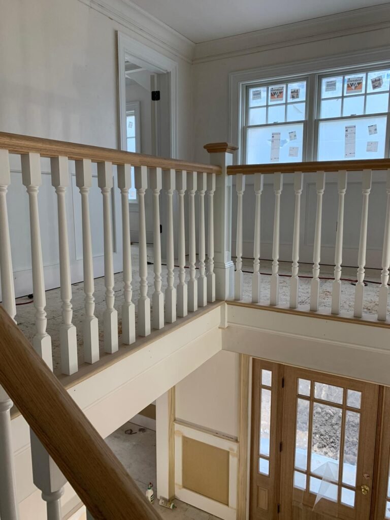 Balcony railing and staircase handrail by WHB Construction Corp.
