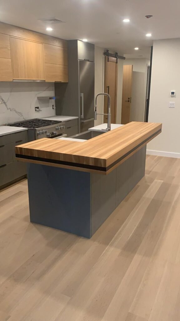 Kitchen island and cabinets by WHB Construction Corp.